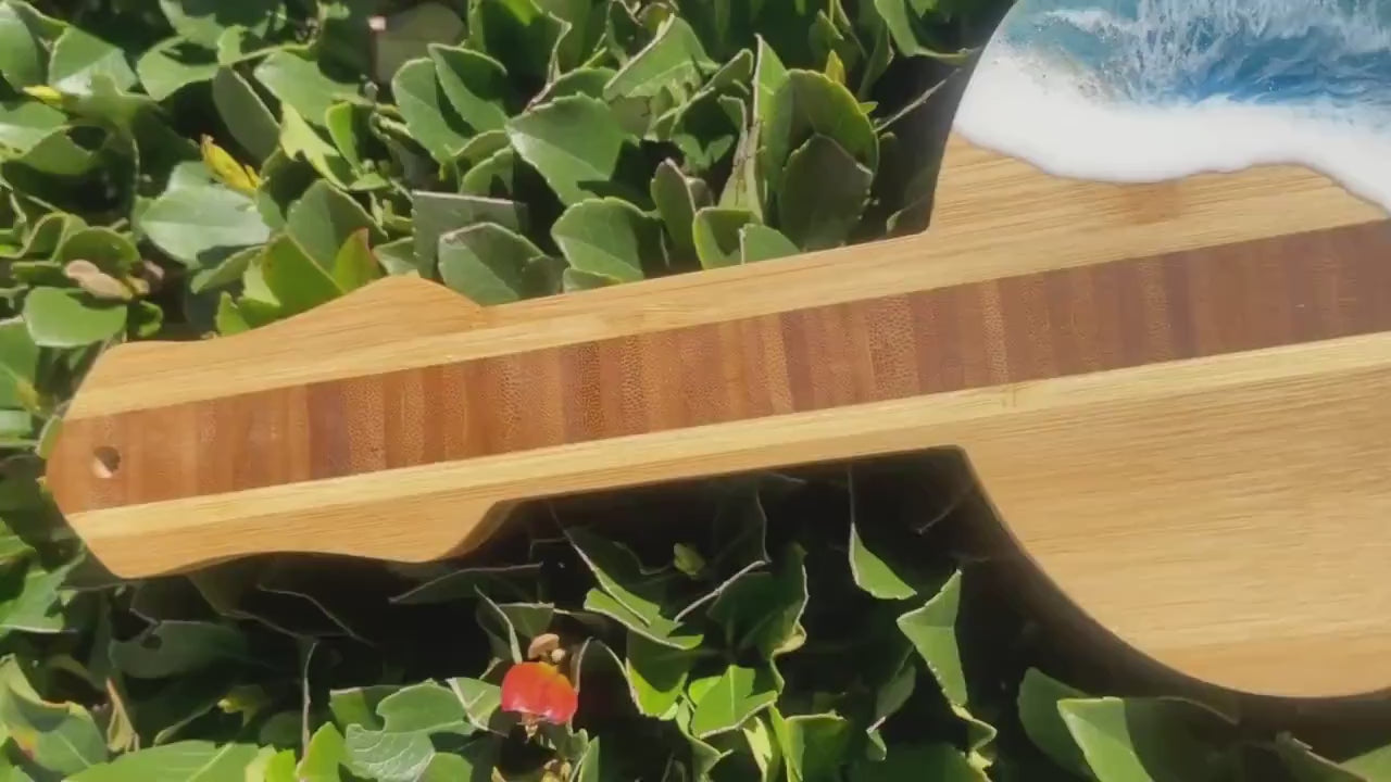 Guitar Shaped Ocean Resin Bamboo Serving and Cutting Board β a harmonious blend of musical inspiration and culinary functionality.