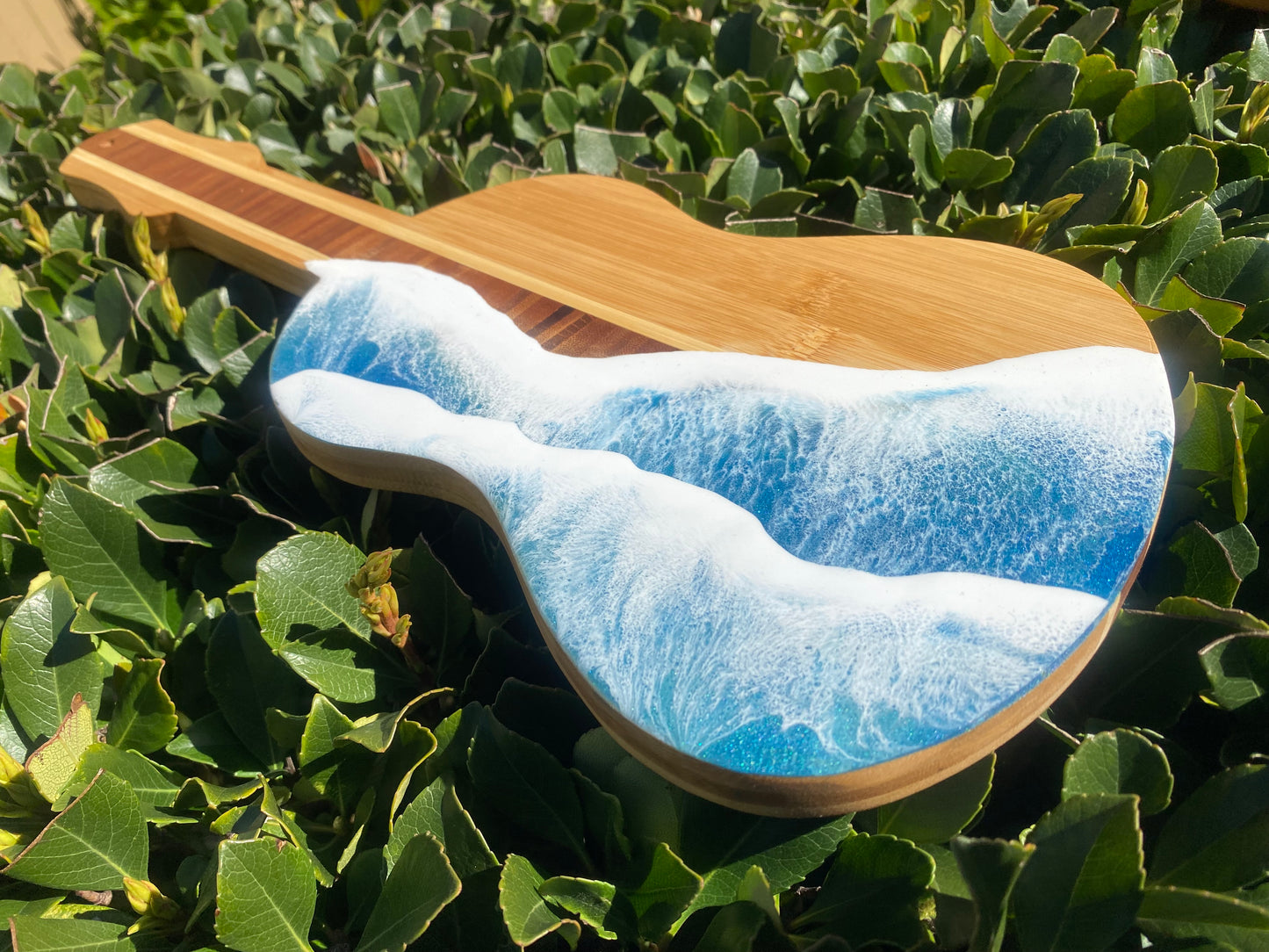 Guitar Shaped Ocean Resin Bamboo Serving and Cutting Board – a harmonious blend of musical inspiration and culinary functionality.