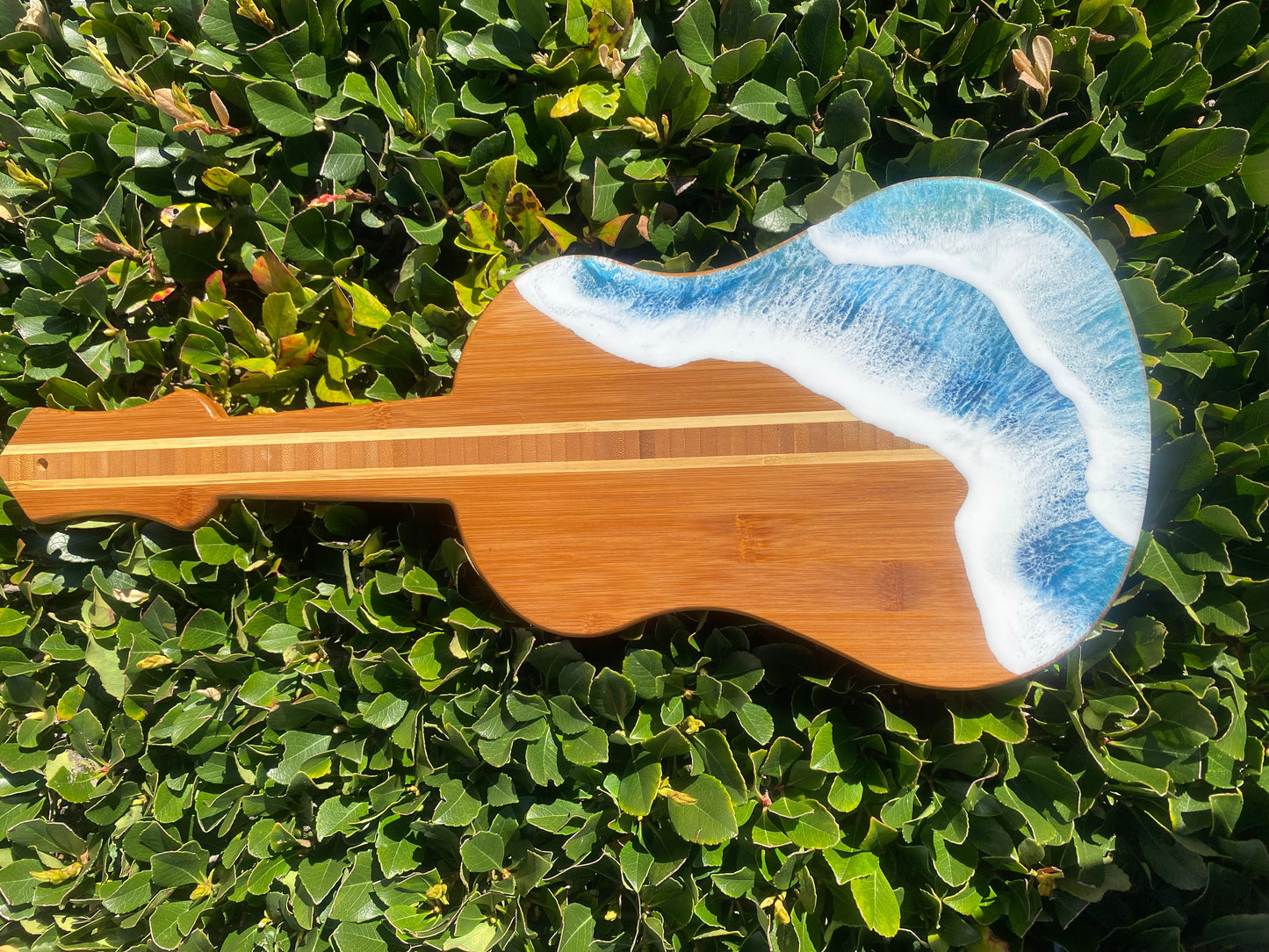 Guitar Shaped Ocean Resin Bamboo Serving and Cutting Board – a harmonious blend of musical inspiration and culinary functionality.