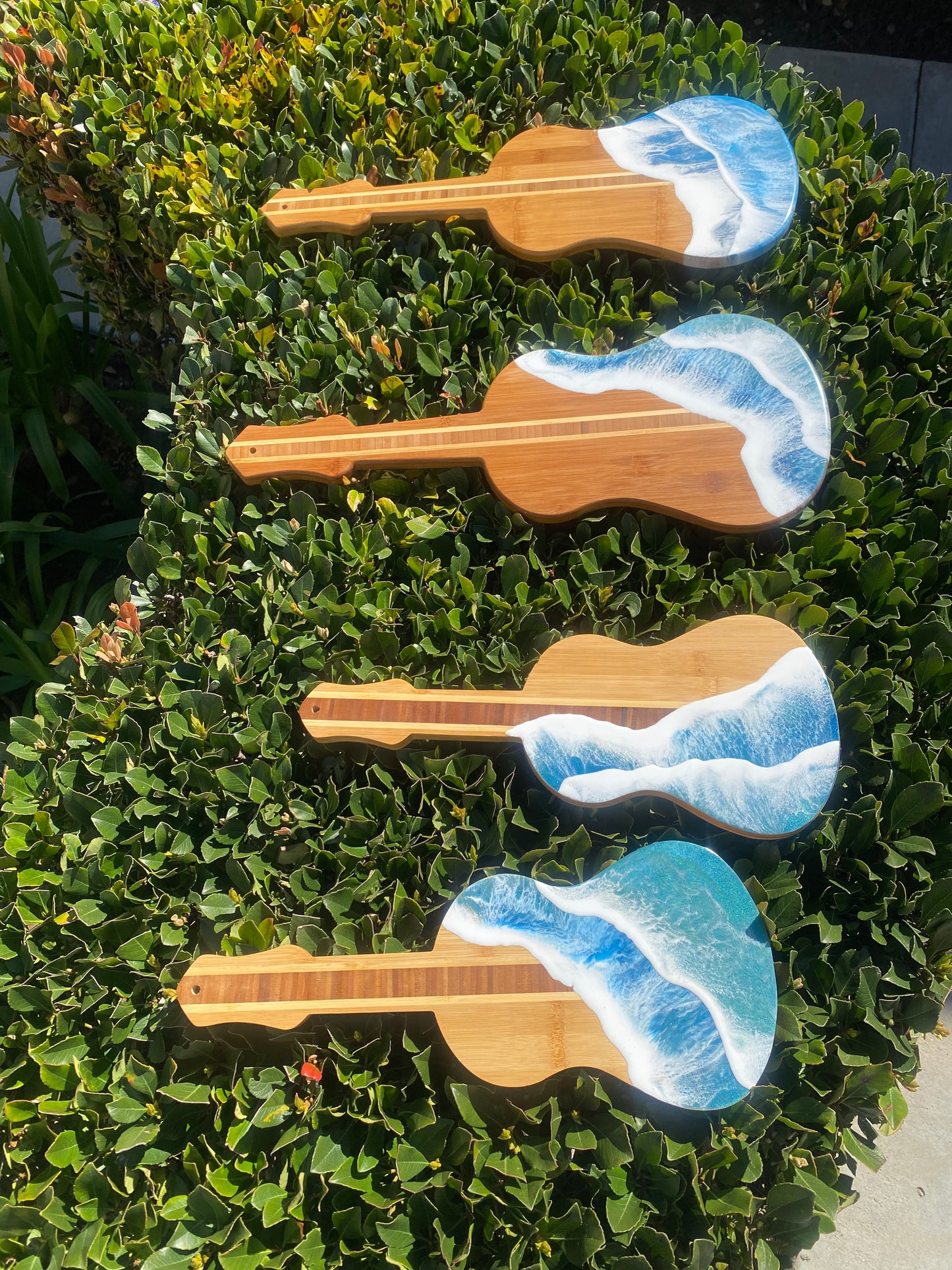 Guitar Shaped Ocean Resin Bamboo Serving and Cutting Board – a harmonious blend of musical inspiration and culinary functionality.