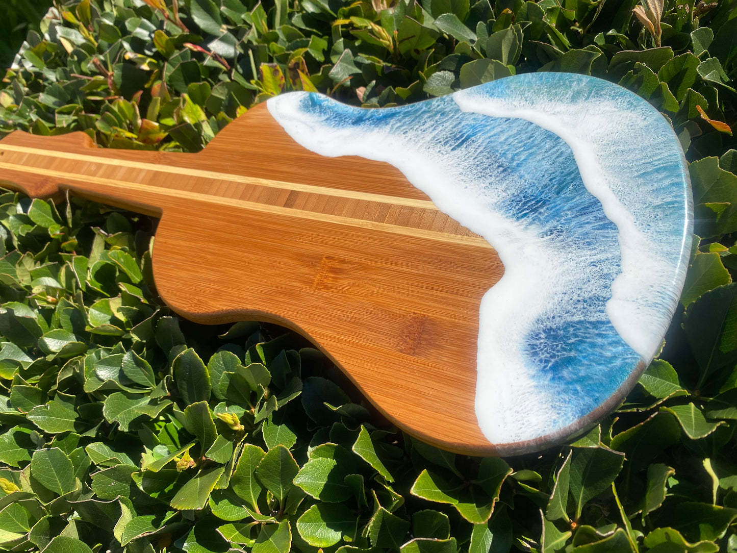 Guitar Shaped Ocean Resin Bamboo Serving and Cutting Board – a harmonious blend of musical inspiration and culinary functionality.